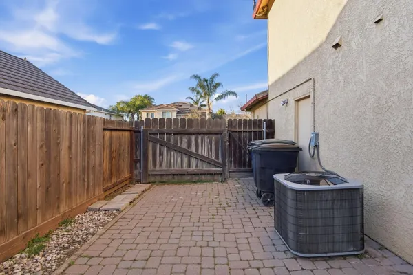 a view of a porch with wooden floor and fence