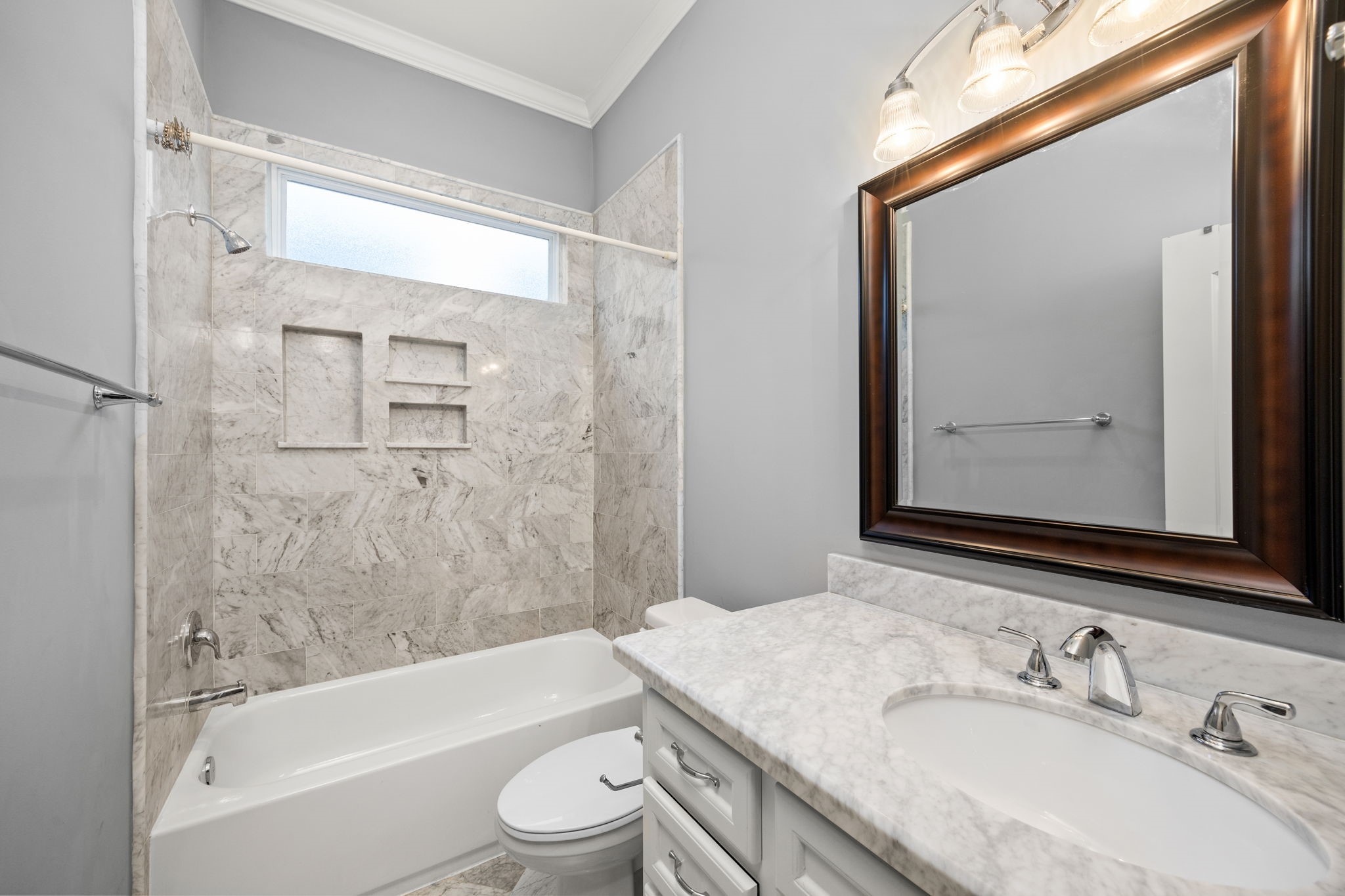 619 Rutland Street, Unit B Houston, TX 77007 - Photo 24 of 33 a bathroom with a granite countertop sink toilet and shower