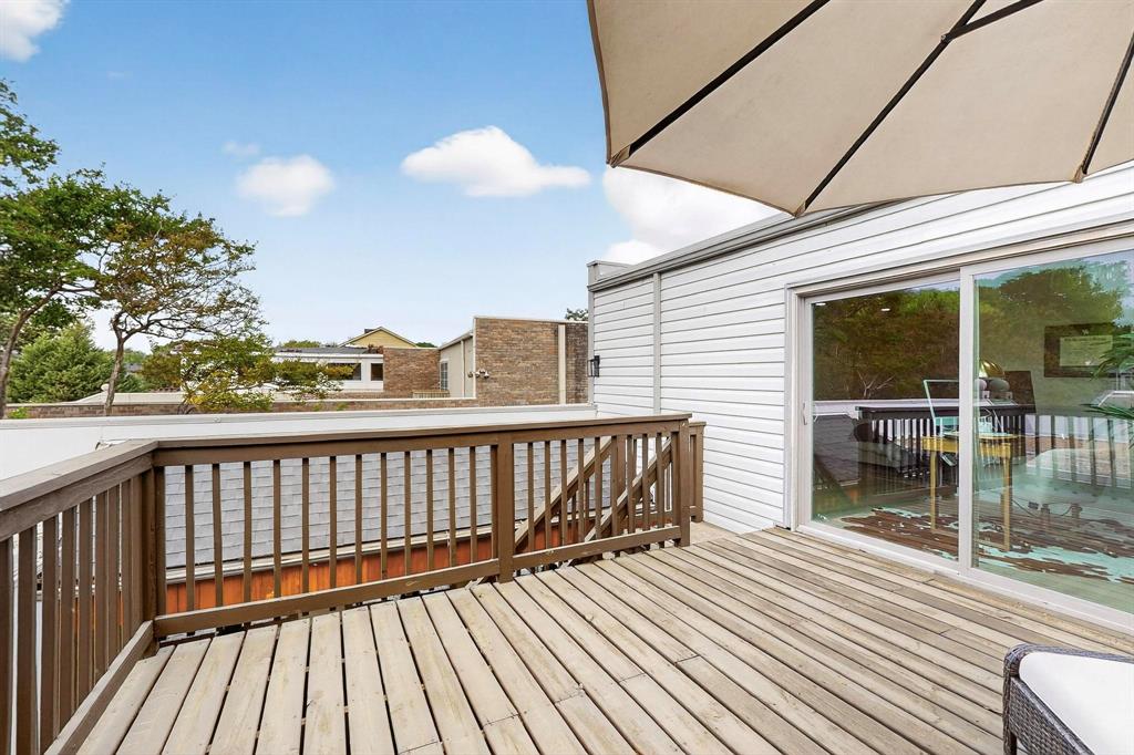 5015 Thunder Road Dallas, TX 75244 - Photo 26 of 31 a view of balcony with wooden floor