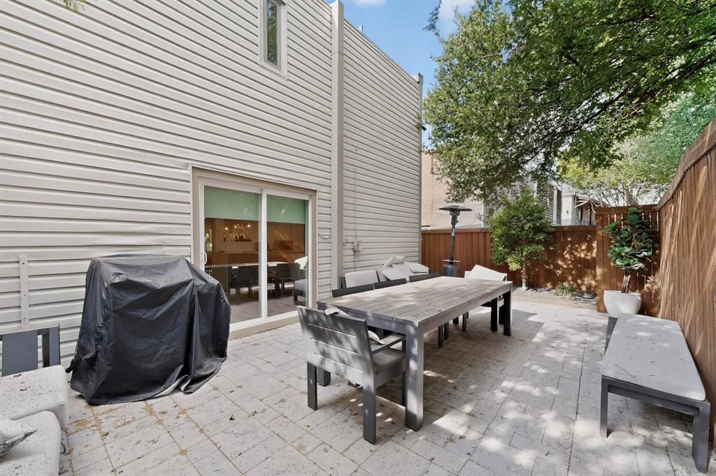 5015 Thunder Road Dallas, TX 75244 - Photo 29 of 31 a view of a dinning table and chairs in the back yard of the house