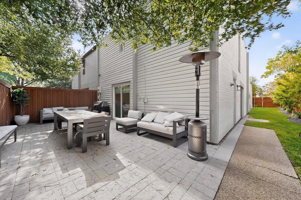 5015 Thunder Road Dallas, TX 75244 - Photo 30 of 31 a view of a patio with table and chairs with wooden fence and plants