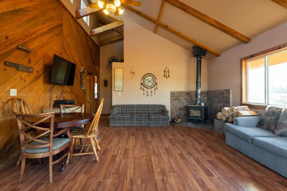 23220 Bliss Road Sprague River, OR 97639 - Photo 9 of 35 a living room with furniture and a wooden floor