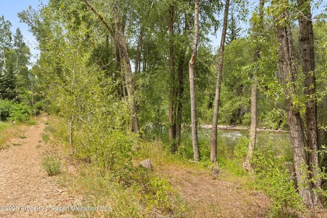 a view of swimming pool from a lake view