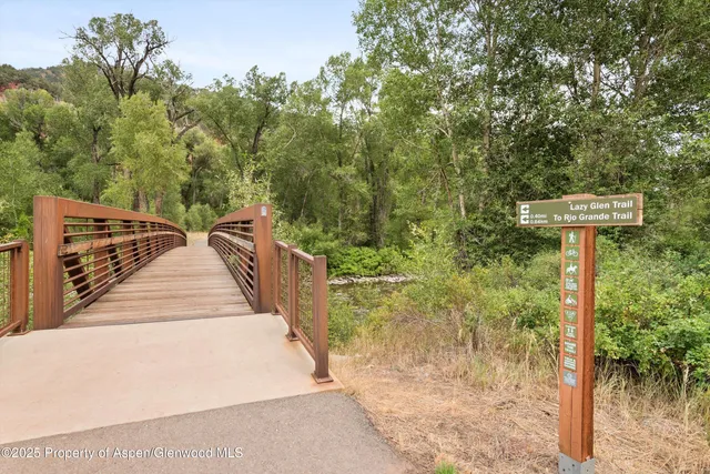 a view of a street with trees in front of it