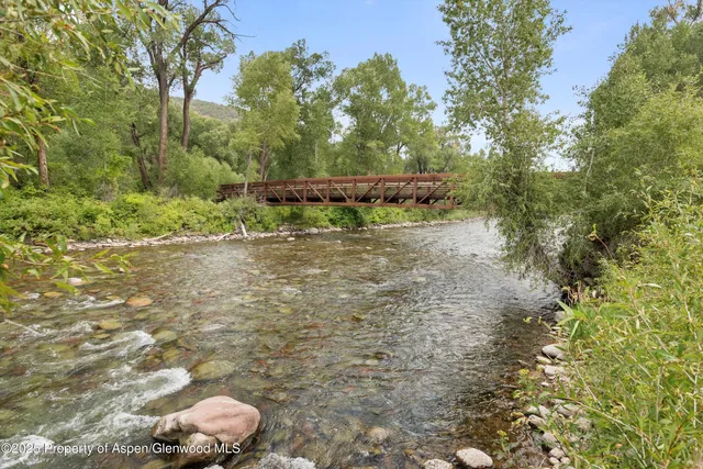 a view of a pathway both side of yard