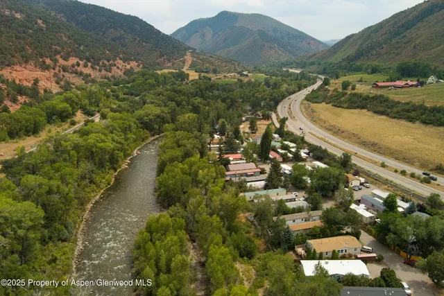 a view of a town with mountains in the background