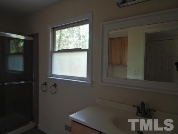 5013 Will-O-Dean Road Raleigh, NC 27616 - Photo 11 of 15 a bathroom with a sink and a window