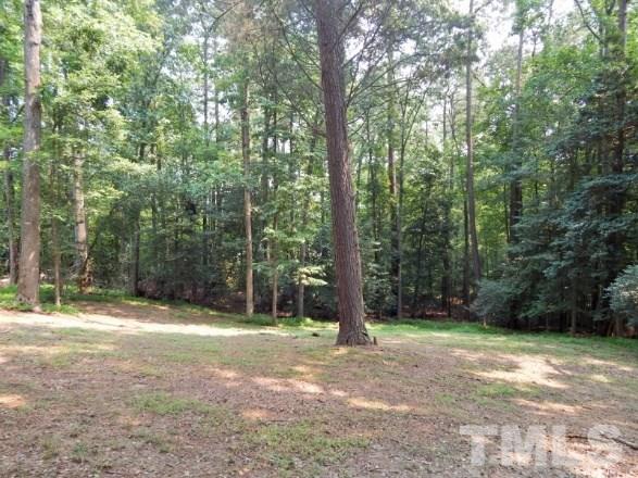 5013 Will-O-Dean Road Raleigh, NC 27616 - Photo 15 of 15 a backyard of a house with lots of green space