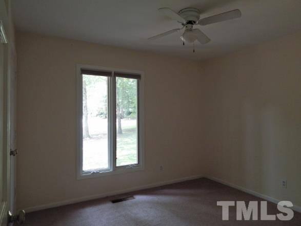 5013 Will-O-Dean Road Raleigh, NC 27616 - Photo 3 of 15 an empty room with a window