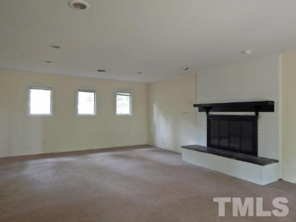 5013 Will-O-Dean Road Raleigh, NC 27616 - Photo 7 of 15 a view of an empty room with a fireplace
