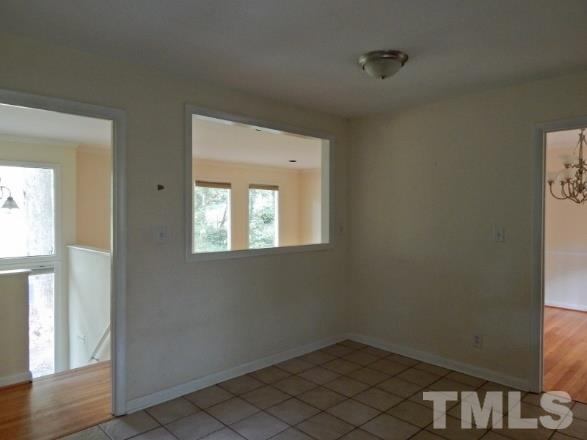 5013 Will-O-Dean Road Raleigh, NC 27616 - Photo 9 of 15 a view of an empty room with wooden floor and a window