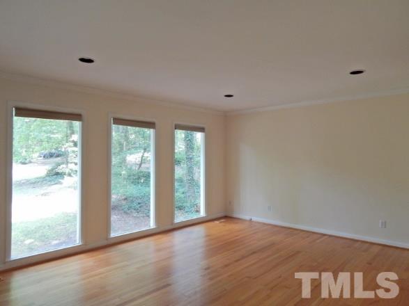 5013 Will-O-Dean Road Raleigh, NC 27616 - Photo 10 of 15 a view of an empty room with wooden floor and a window