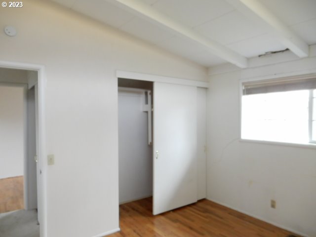 2455 Van Buren Street Eugene, OR 97405 - Photo 17 of 31 a view of an empty room with wooden floor and a window