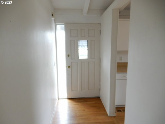 2455 Van Buren Street Eugene, OR 97405 - Photo 2 of 31 a view of an empty room with wooden floor and a window