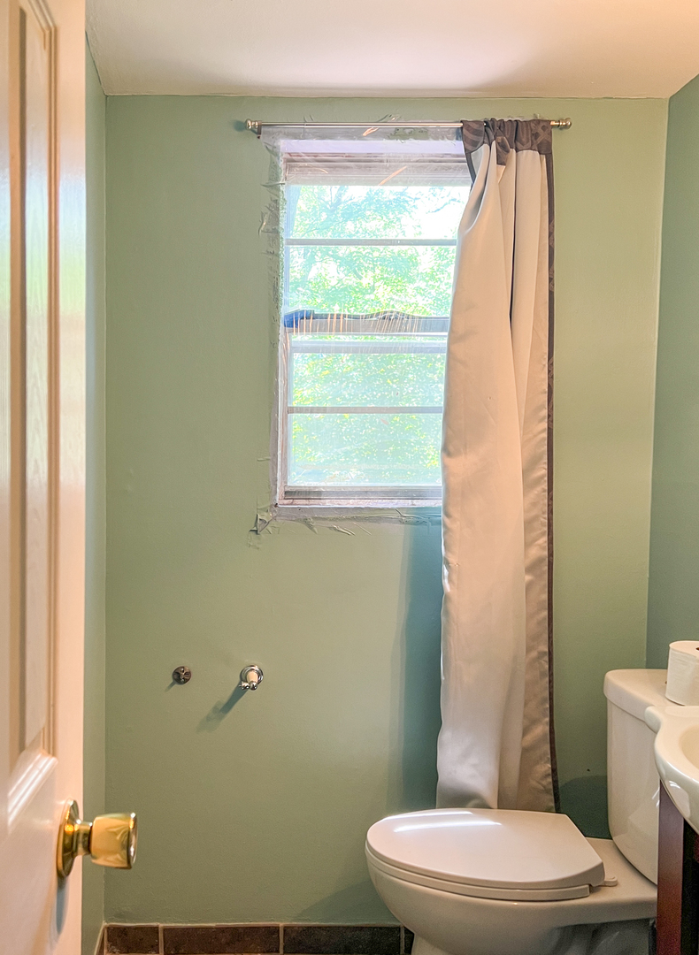 294 Seabury Road Bolingbrook, IL 60440 - Photo 9 of 17 a bathroom with a toilet a sink and a mirror