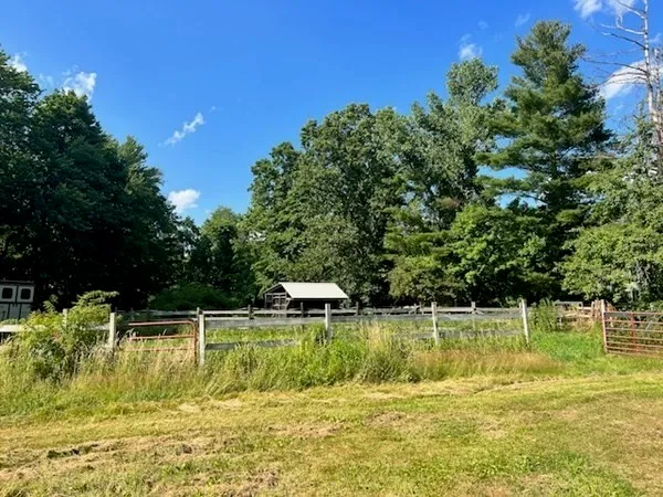 a view of a lake with a house in the background