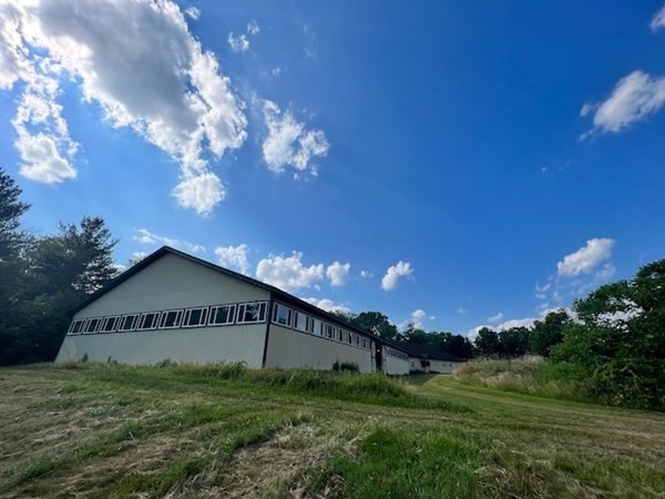 233 Mort Vining Road Southwick, MA 01077 - Photo 16 of 31 a view of a house bedroom with a big yard