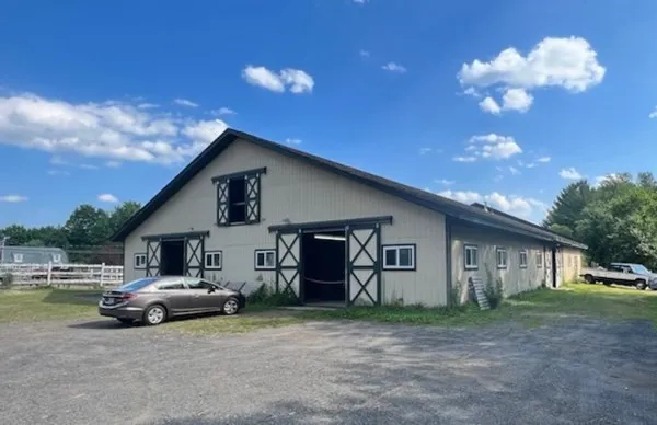 a view of room with wooden floor