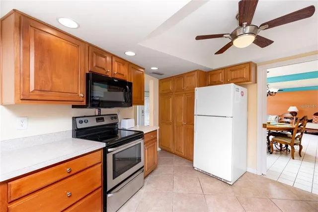 a kitchen with granite countertop a sink and a counter top space