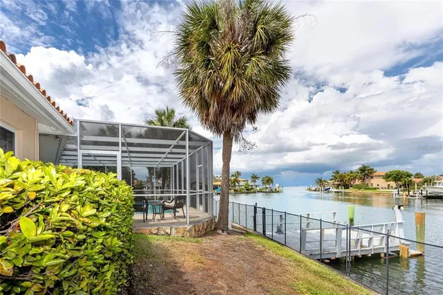 a dining room with furniture and a floor to ceiling window