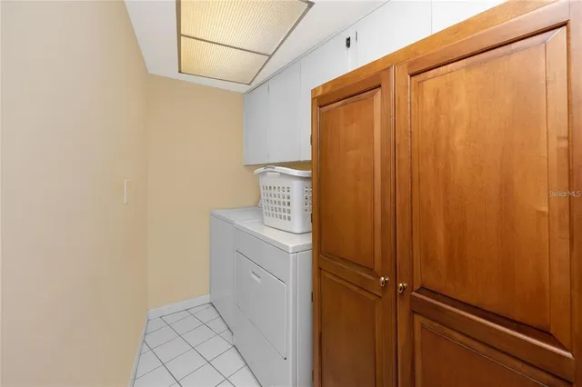 a view of a patio with dining table and chairs