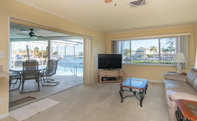 a view of a balcony with lake view and a floor to ceiling window