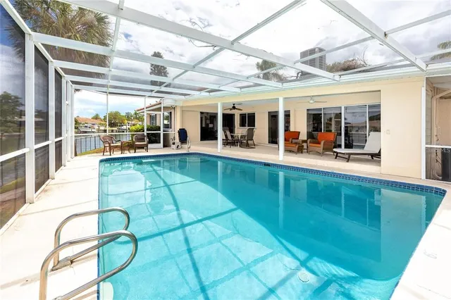 a view of a swimming pool with a outdoor seating