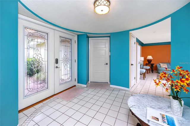 a view of an entryway with wooden floor