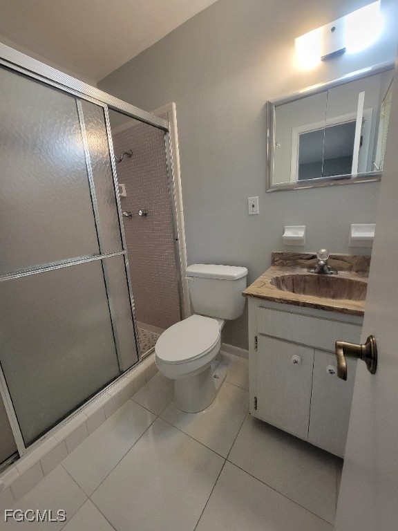 347 Richland Road Lehigh Acres, FL 33936 - Photo 12 of 16 a bathroom with a granite countertop sink toilet and shower