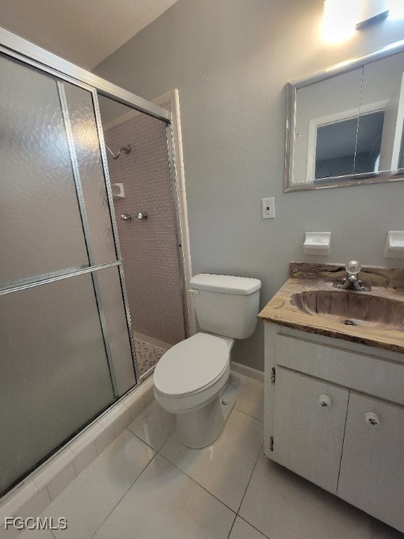 347 Richland Road Lehigh Acres, FL 33936 - Photo 13 of 16 a bathroom with a granite countertop toilet sink and shower