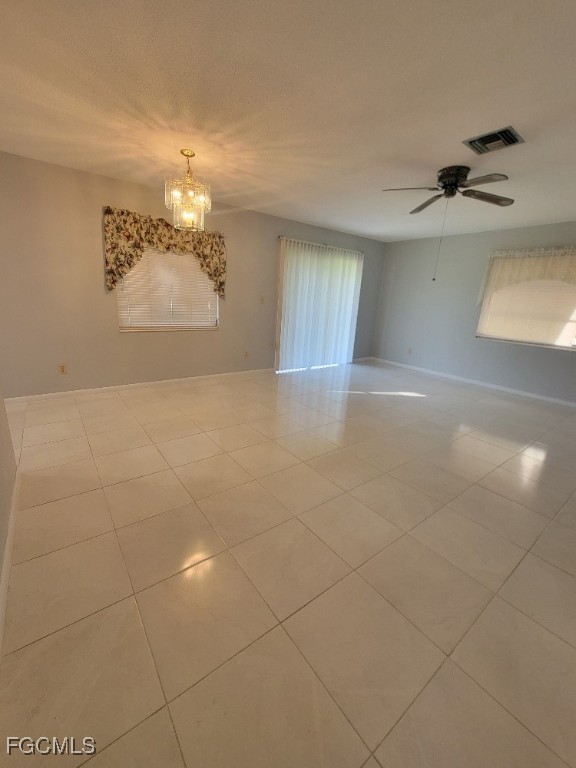347 Richland Road Lehigh Acres, FL 33936 - Photo 4 of 16 a view of a livingroom with a chandelier
