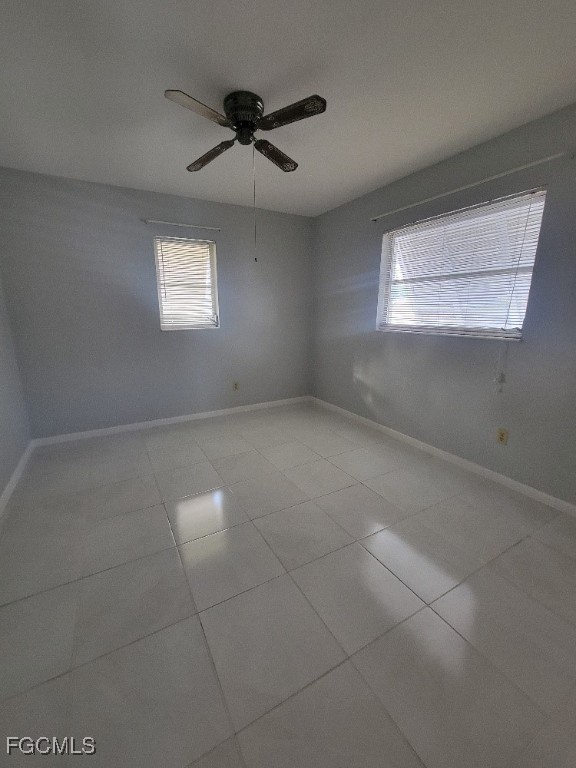 347 Richland Road Lehigh Acres, FL 33936 - Photo 9 of 16 a view of an empty room with a window