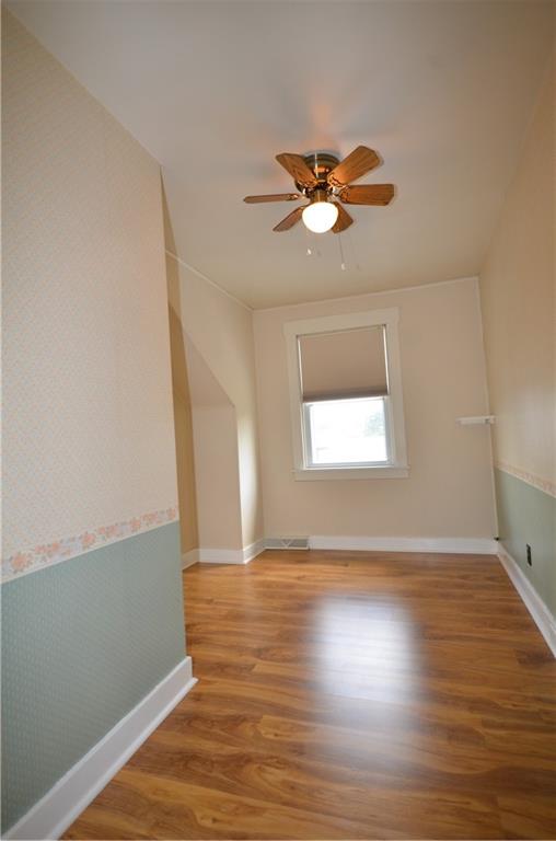 1020 6th Street Beaver, PA 15009 - Photo 15 of 33 a view of empty room with wooden floor and fan
