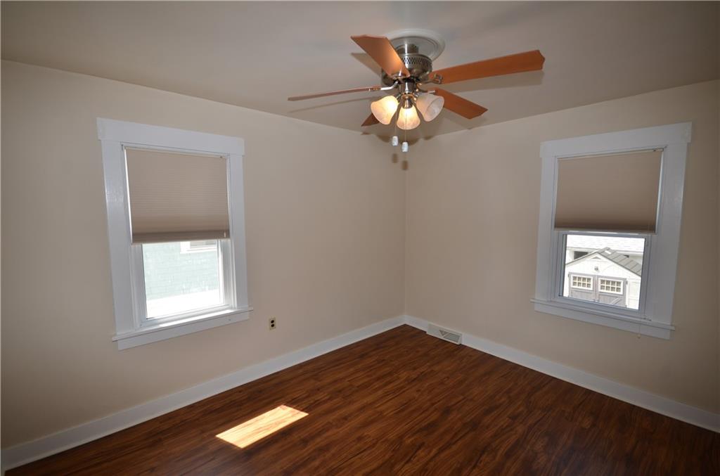 1020 6th Street Beaver, PA 15009 - Photo 17 of 33 wooden floor in an empty room with a window
