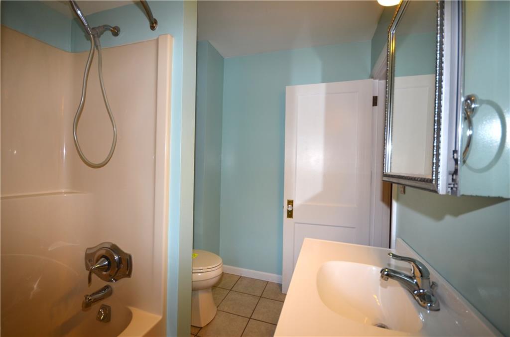 1020 6th Street Beaver, PA 15009 - Photo 19 of 33 a bathroom with a sink toilet and shower
