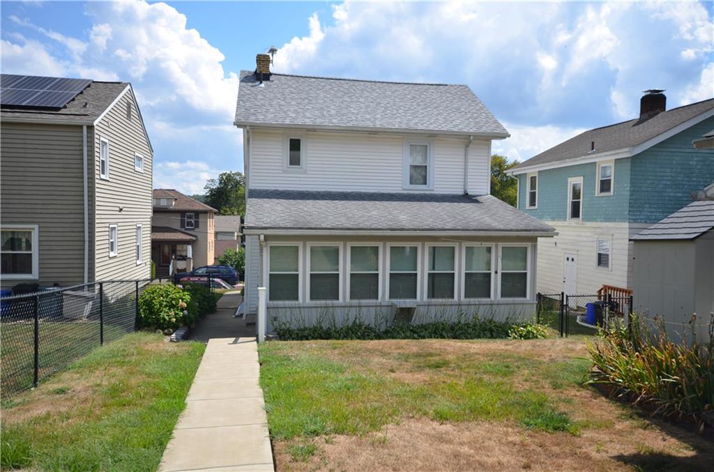 1020 6th Street Beaver, PA 15009 - Photo 23 of 33 a front view of a house with a garden