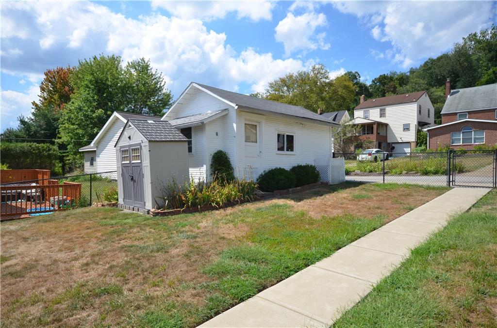 1020 6th Street Beaver, PA 15009 - Photo 24 of 33 a view of a house with backyard and trees