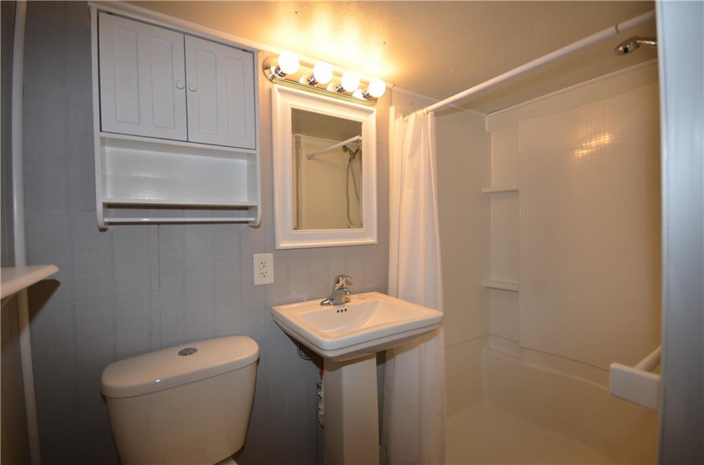 1020 6th Street Beaver, PA 15009 - Photo 28 of 33 a bathroom with a toilet a sink and mirror
