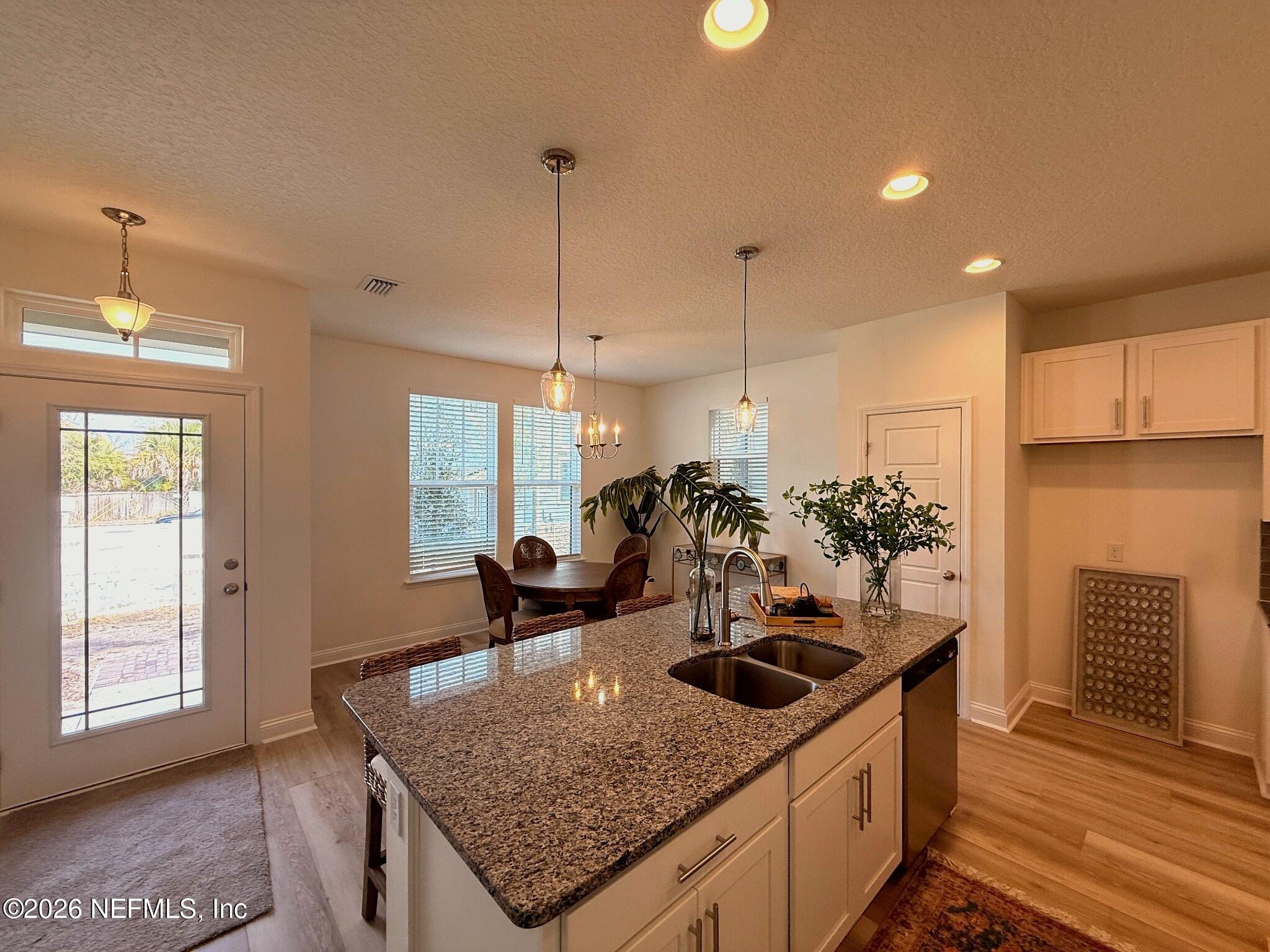 2913 Fleur Lane Jacksonville, FL 32205 - Photo 5 of 22 a kitchen with stainless steel appliances granite countertop a sink a stove and a wooden floors