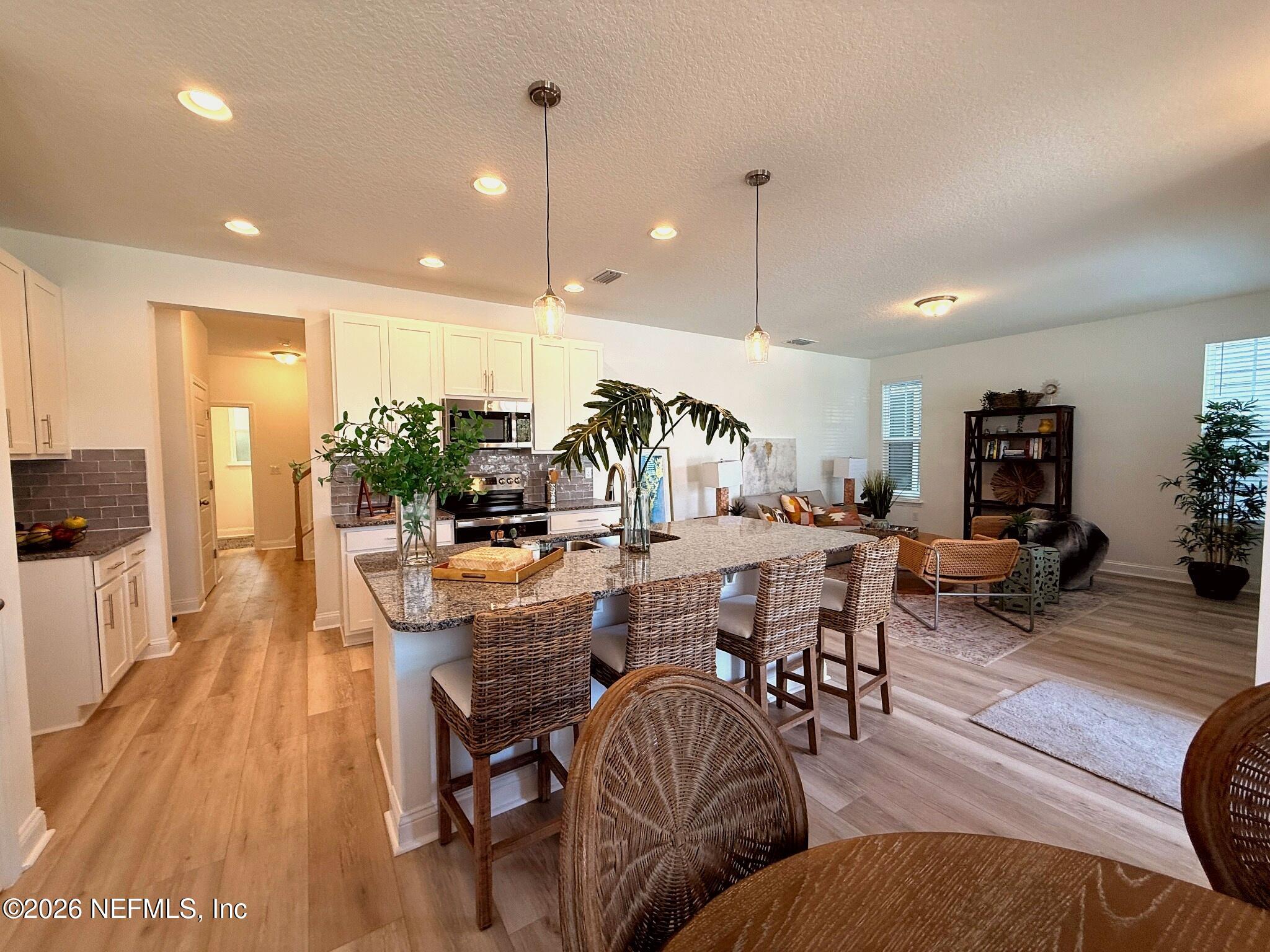 2913 Fleur Lane Jacksonville, FL 32205 - Photo 6 of 22 a view of a dining area with furniture and wooden floor