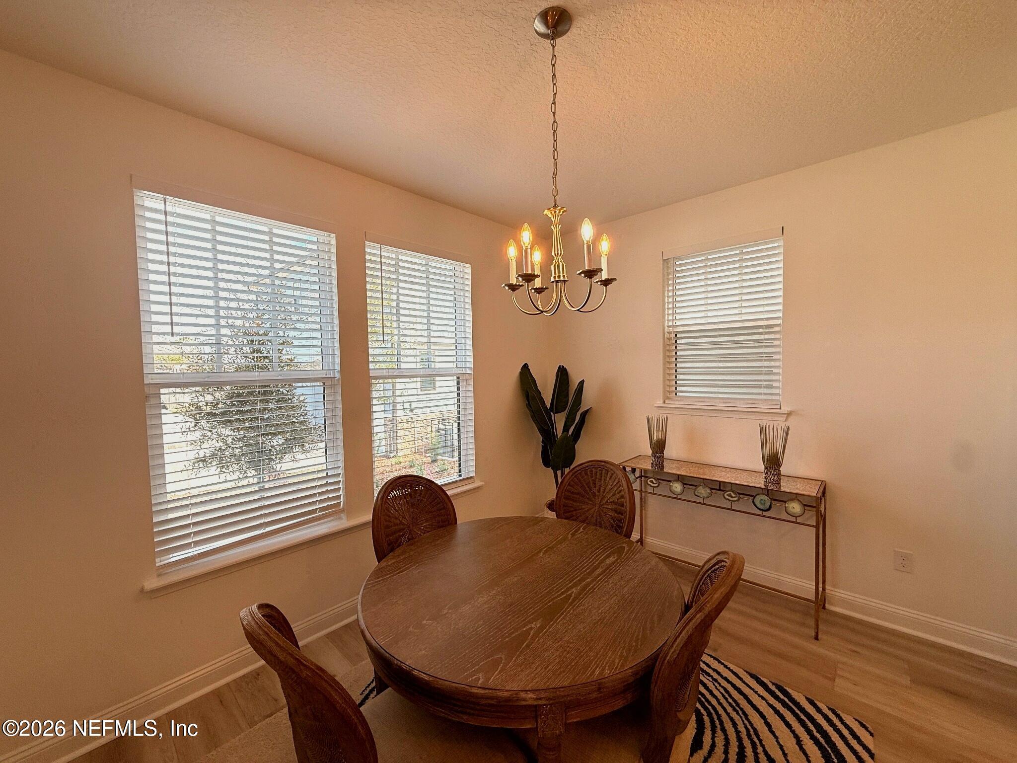 2913 Fleur Lane Jacksonville, FL 32205 - Photo 8 of 22 a view of a dining room with furniture window and outside view