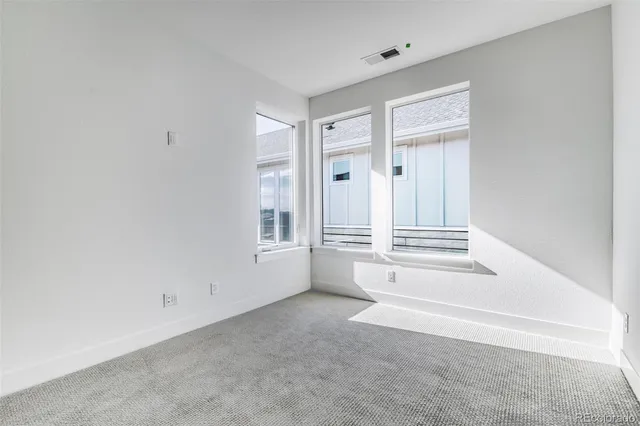 a view of empty room with windows