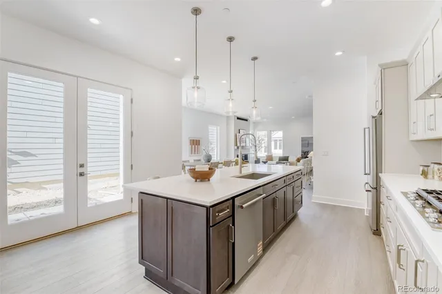 a kitchen with a stove and a sink
