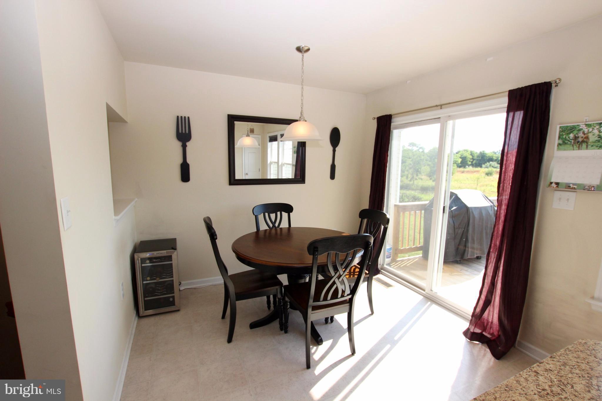 1129 Stallion Street Ranson, WV 25438 - Photo 11 of 19 a view of a dining room with furniture window and outside view