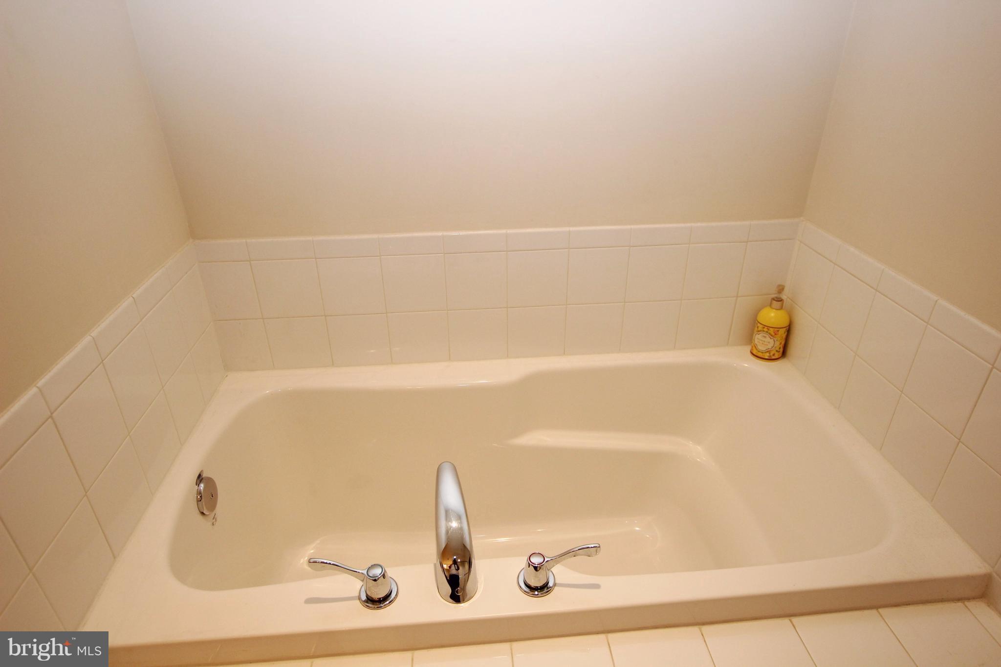 1129 Stallion Street Ranson, WV 25438 - Photo 14 of 19 a close up of a bathtub