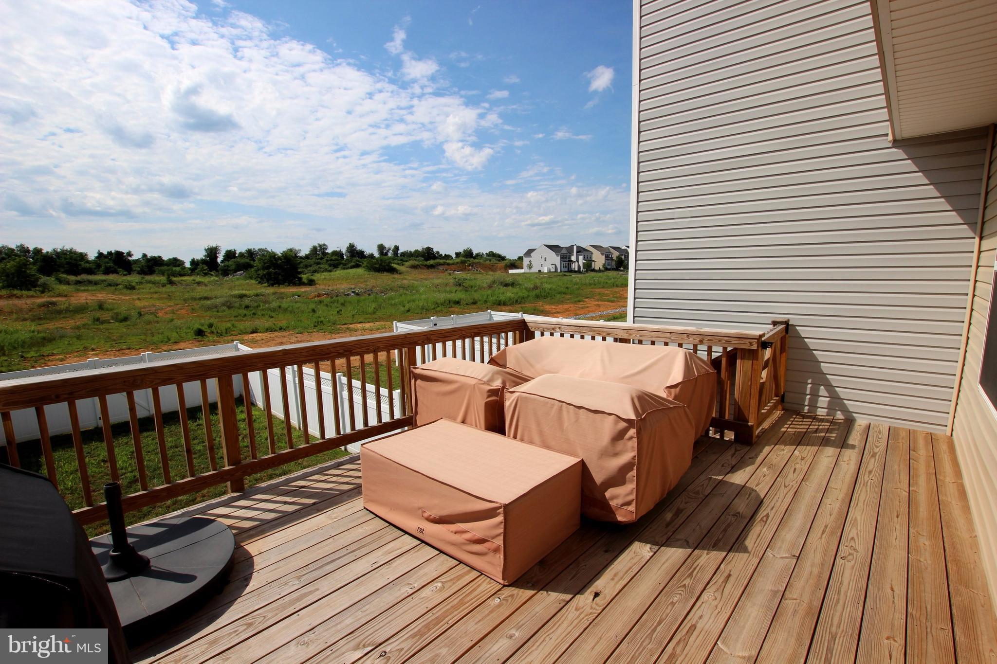 1129 Stallion Street Ranson, WV 25438 - Photo 18 of 19 a view of roof deck with patio