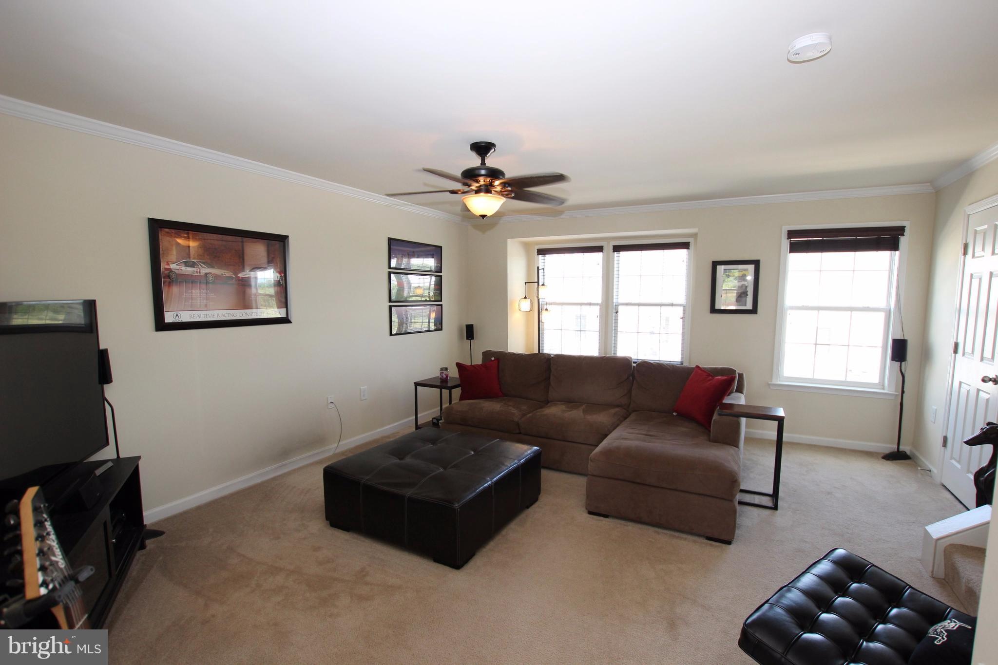 1129 Stallion Street Ranson, WV 25438 - Photo 7 of 19 a living room with furniture and a window