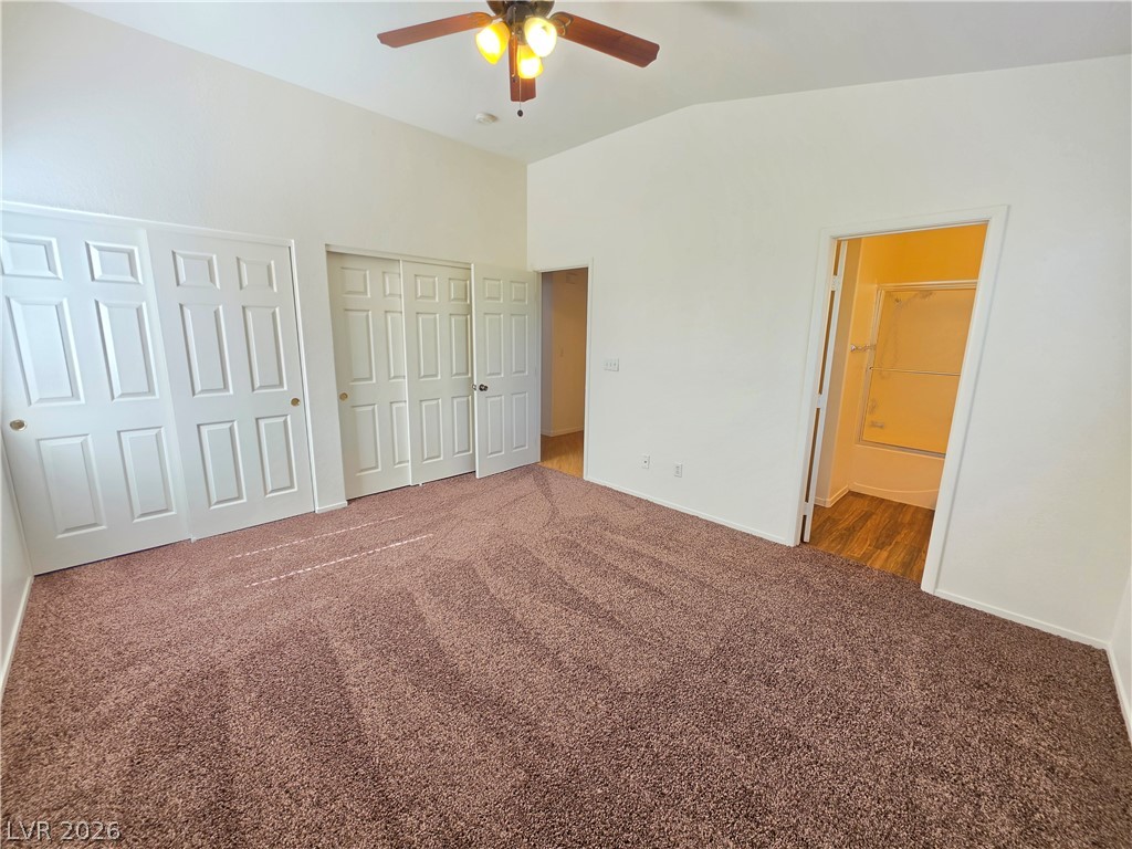 1154 Point Success Avenue Henderson, NV 89014 - Photo 19 of 26 A comfortable bedroom features plush carpeting, ample closet space, and easy access to a private bathroom.