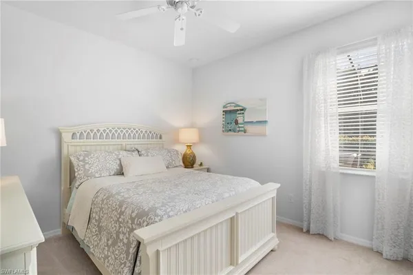 a large white bed in a white room