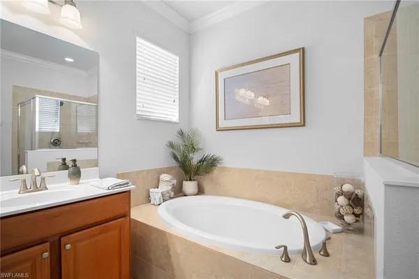 a bathroom with a bathtub and shower
